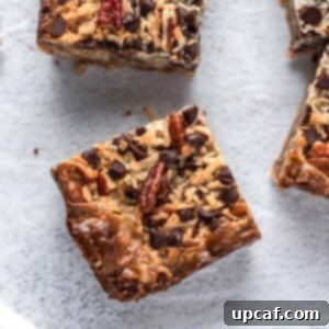 Golden Coconut Dream Bars 8 Top-down view of a single coconut magic bar, showcasing its golden crust and delicious topping.