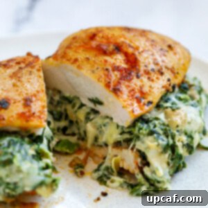Creamy Spinach Artichoke Stuffed Chicken 10 center cut of spinach chicken breast showing filling