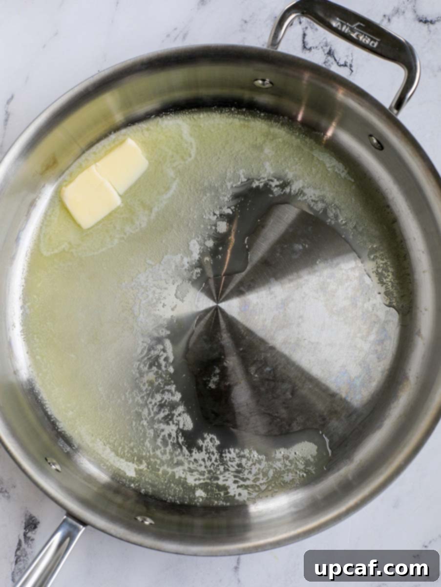 Fiery Buffalo Chicken Pasta Bake 4 Melted butter in a pan.