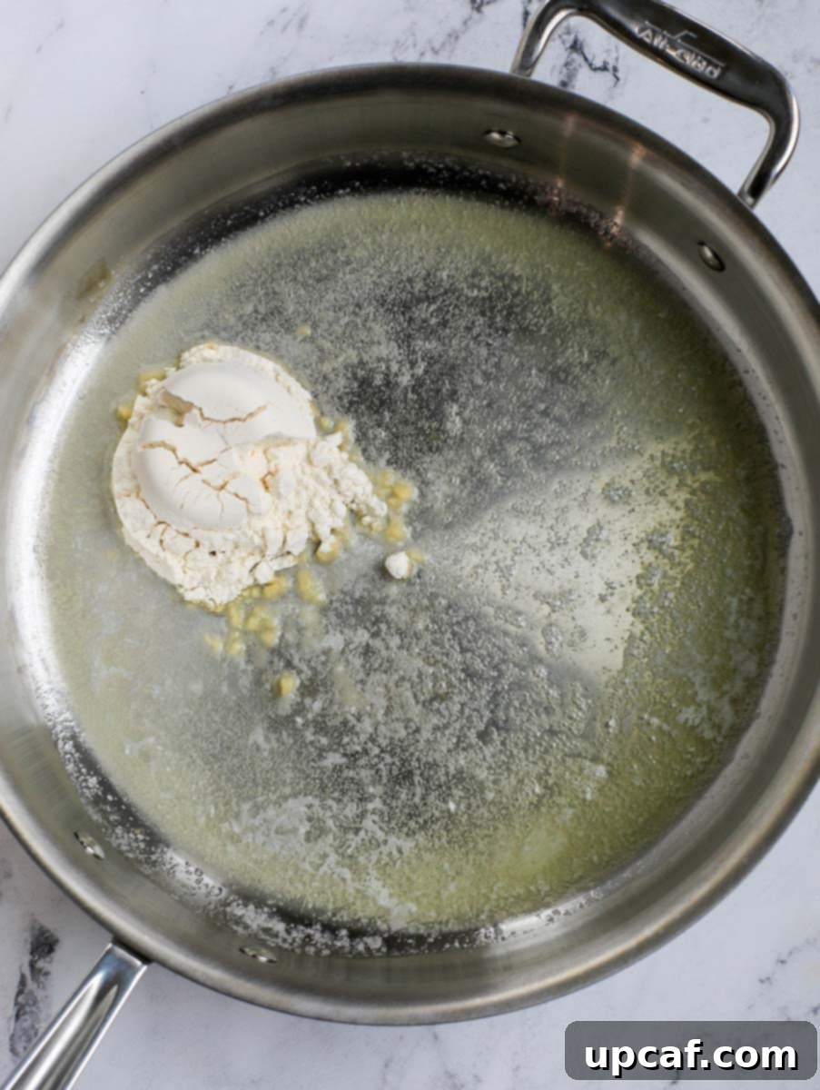 Fiery Buffalo Chicken Pasta Bake 5 Butter and flour in a skillet forming a roux.
