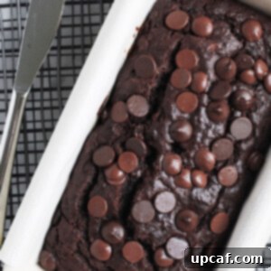 A delicious slice of Chocolate Banana Bread ready to be served, showing its moist texture and rich chocolate content.