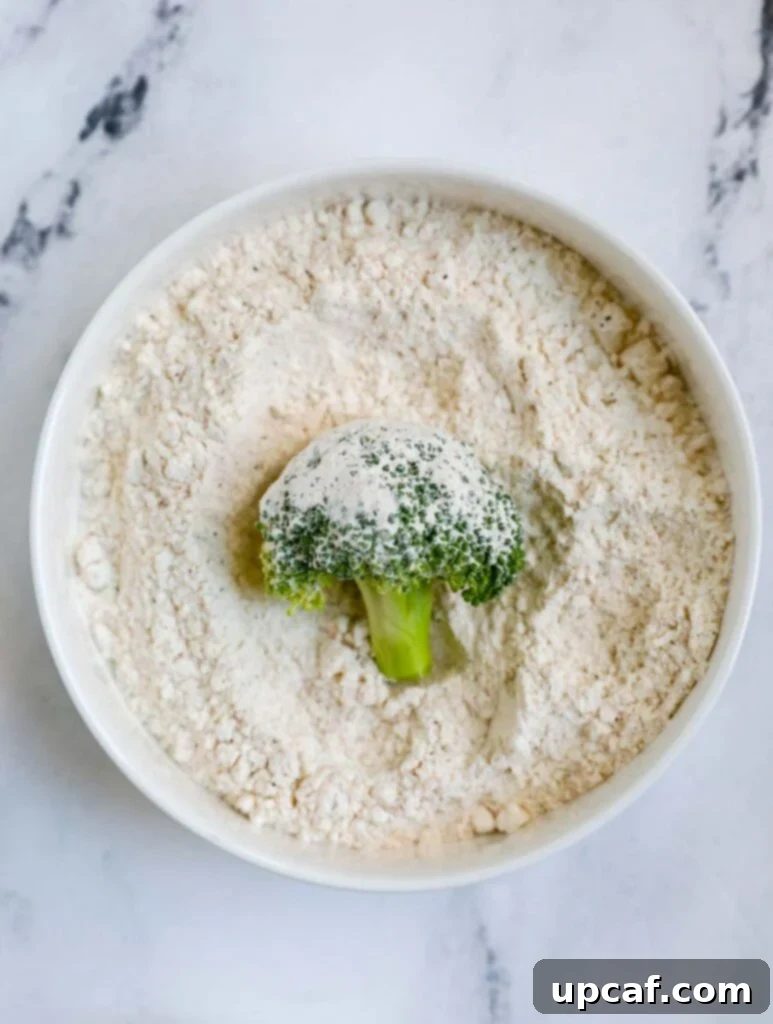 broccoli in a bowl of flour.