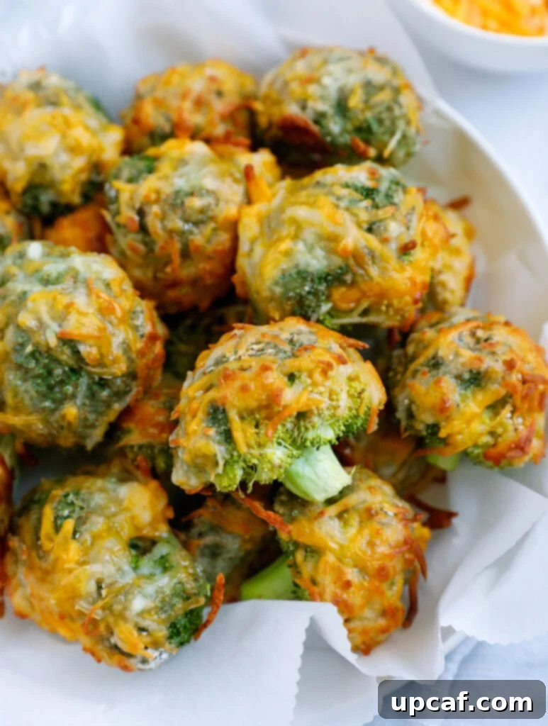 Close up of cheesy broccoli bites in a bowl.