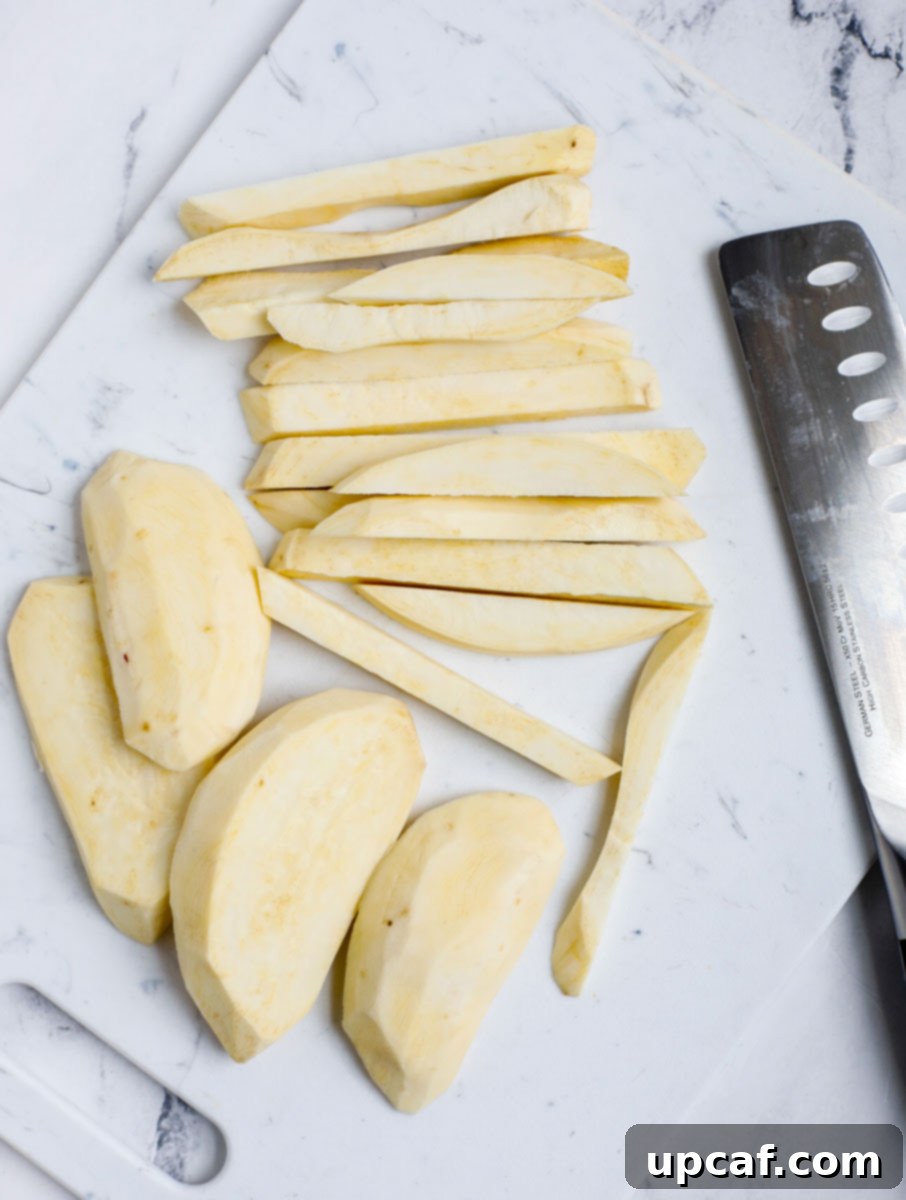 Slices of sweet potato next to a knife.