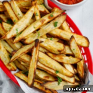 Top down shot of sweet potato fries in a basket.