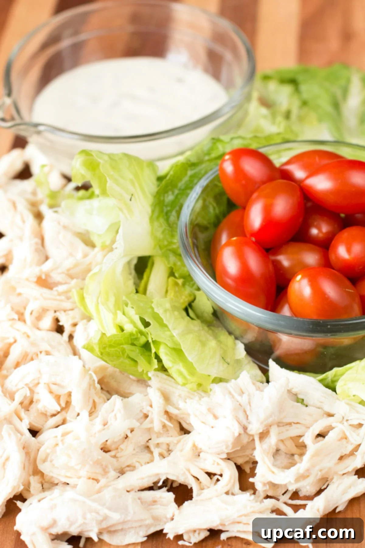 Fast and Fresh Chicken Caesar Wraps 4 Chicken Caesar Wrap Ingredients on a cutting board