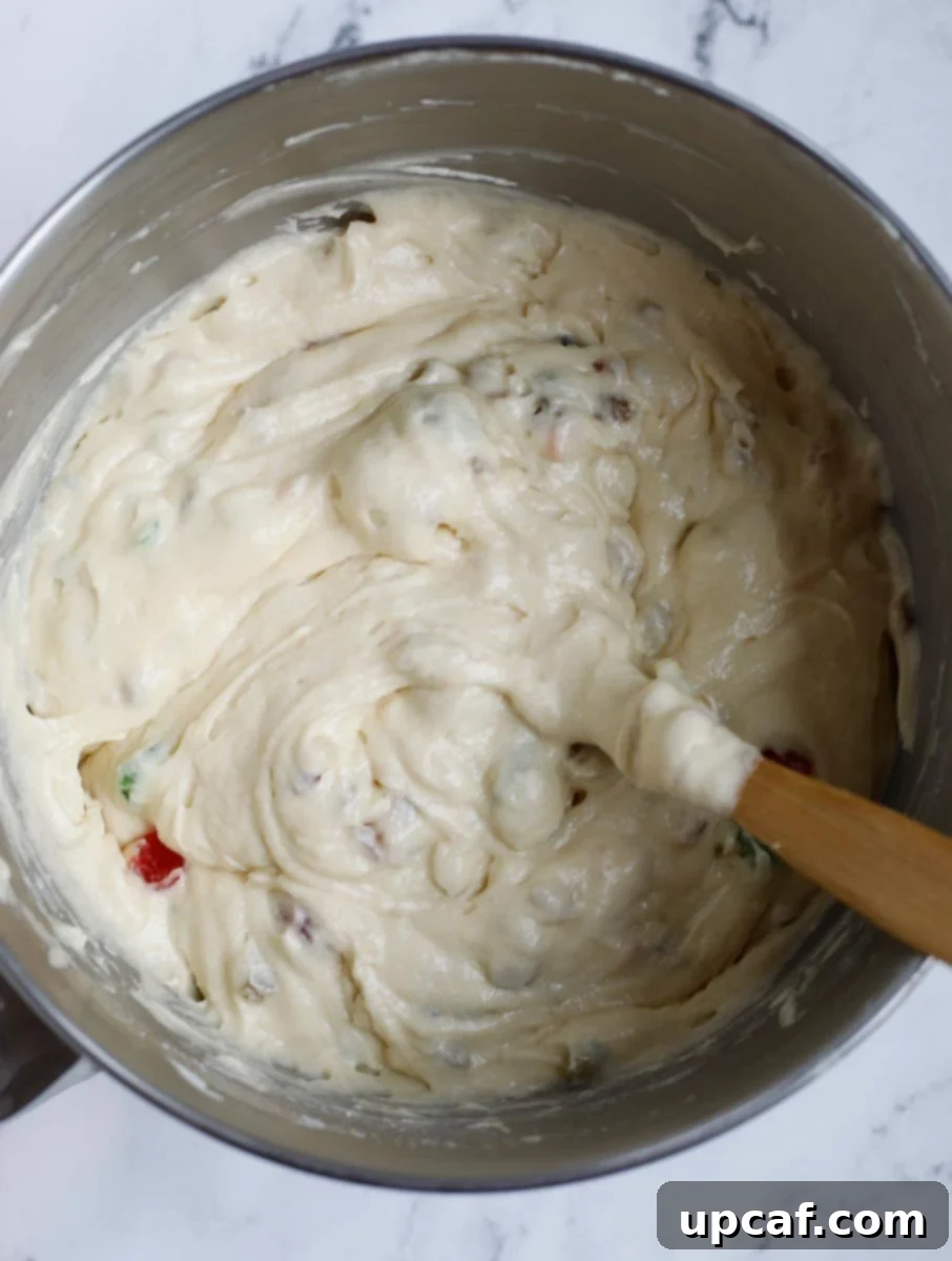 Zesty Holiday Fruitcake 15 The cake batter with dried fruits gently folded in, ensuring even distribution throughout.