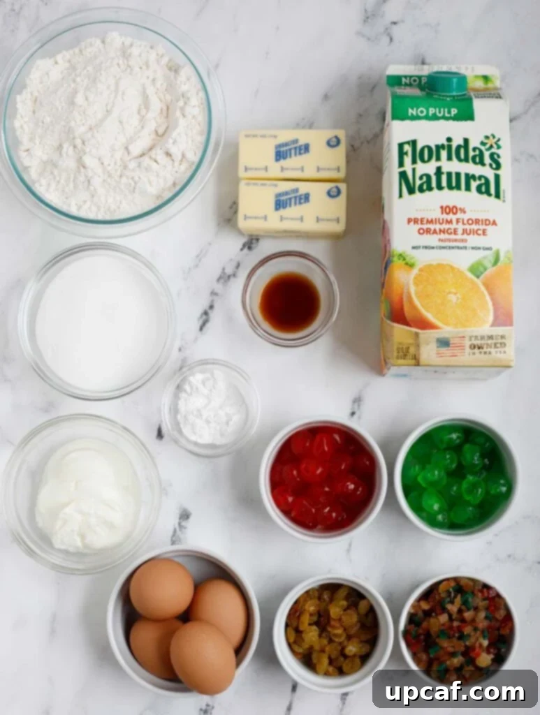 Zesty Holiday Fruitcake 4 All the fresh ingredients for the homemade orange juice fruit cake carefully laid out on a clean surface, ready for baking.