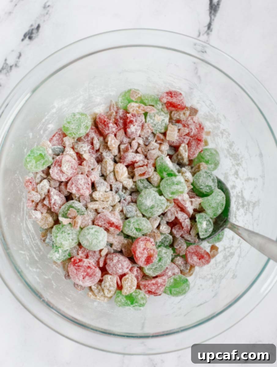 Zesty Holiday Fruitcake 6 The vibrant dried fruits, now lightly dusted and coated with flour, preventing them from sinking in the cake batter.