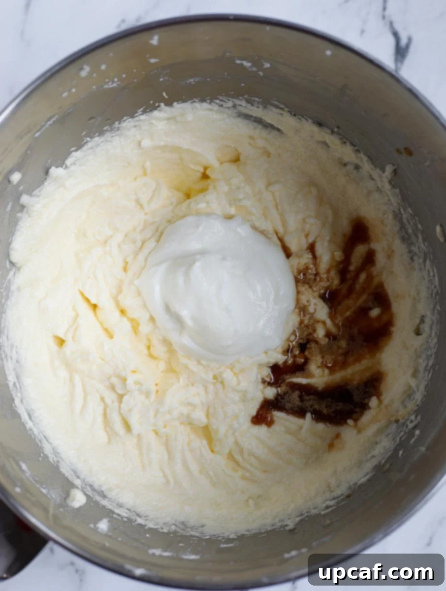 Zesty Holiday Fruitcake 10 Yogurt and vanilla extract smoothly blended into the cake batter.