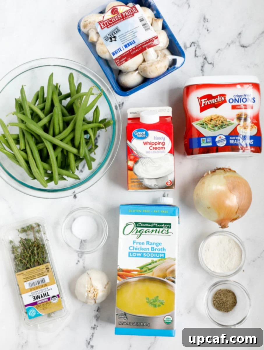 Ultimate Homestyle Green Bean Casserole 3 Top down shot of fresh ingredients for homemade green bean casserole, including green beans, mushrooms, cream, and spices.