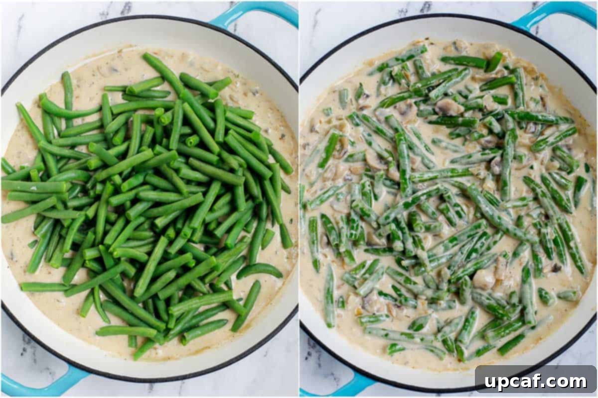Ultimate Homestyle Green Bean Casserole 6 Green beans submerged and coated in a creamy mushroom sauce in a pan.