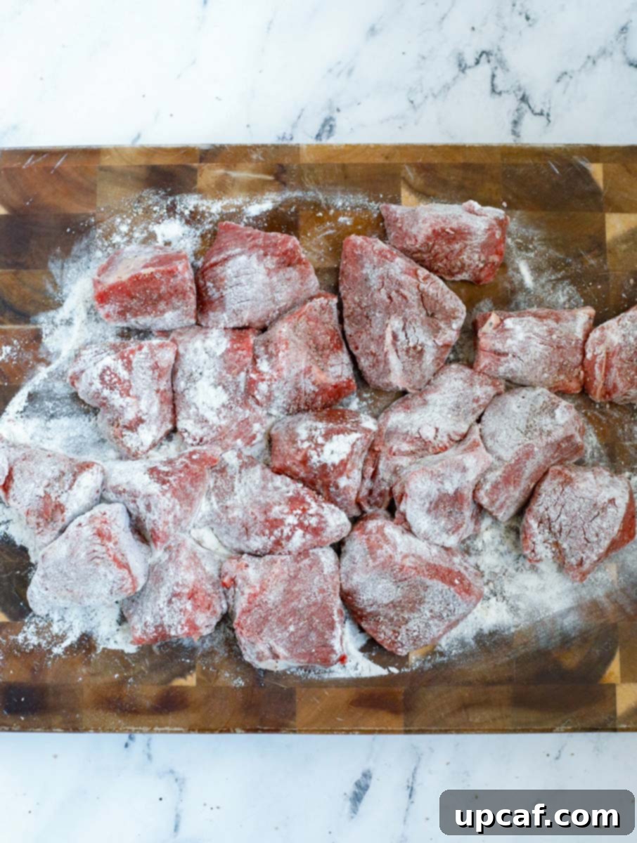 Beef stew chunks covered in flour.