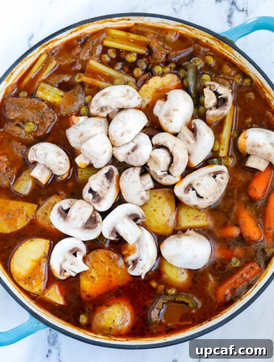 Vegetables and beef in a pot.