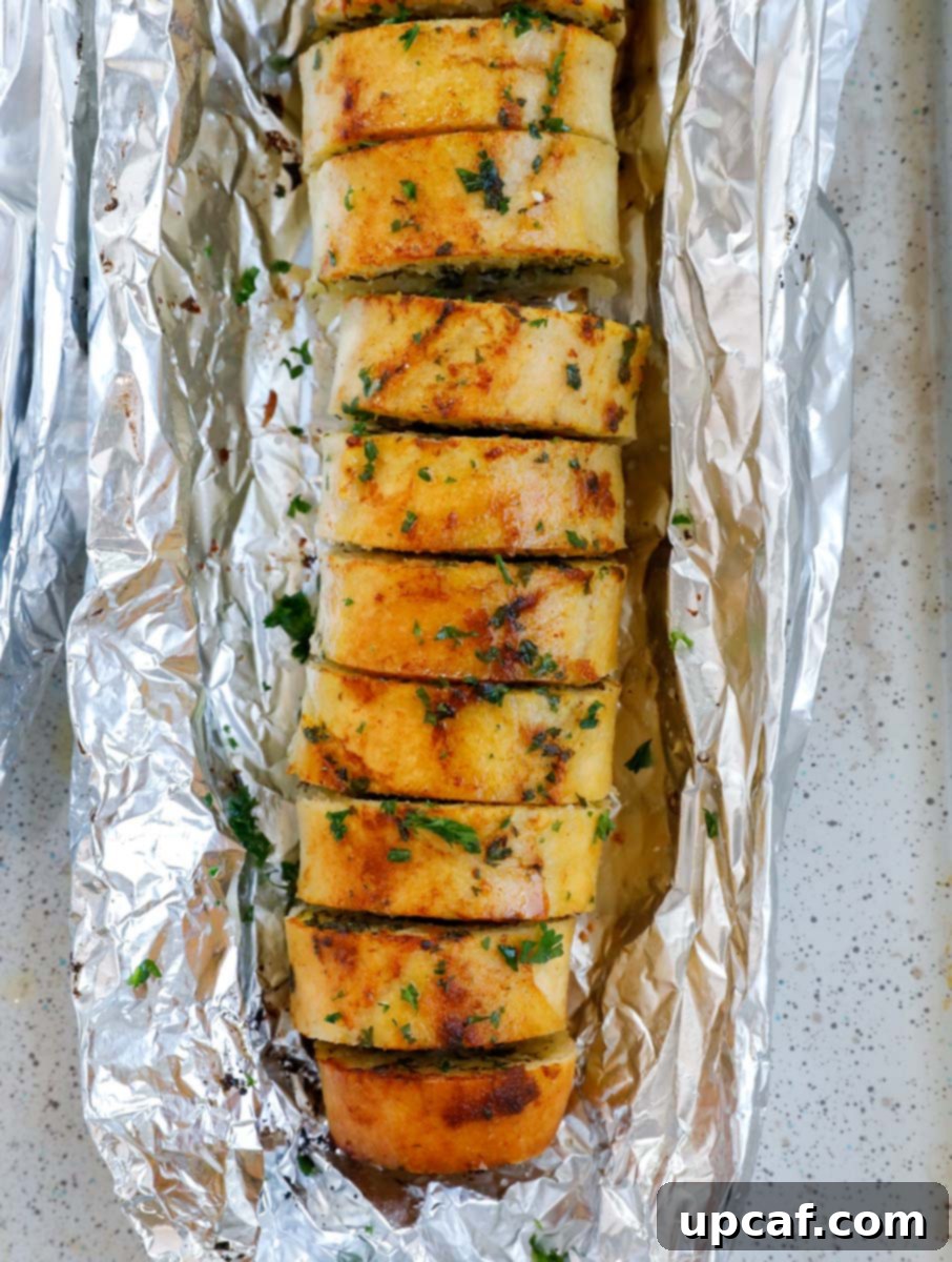 Top down view of easy garlic bread in foil.