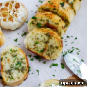 Slices of easy garlic bread on parchment.