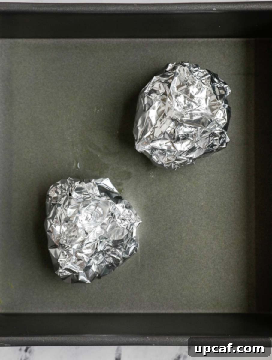 garlic in foil wrap before roasting