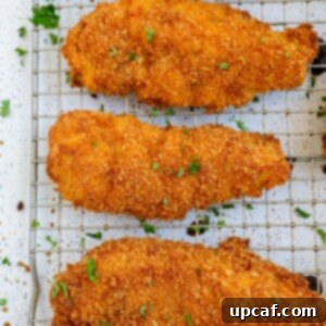 crispy baked chicken tenders on a baking rack