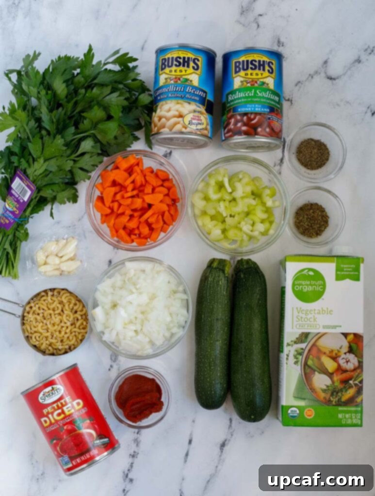 Rustic Vegetable Minestrone 3 Top down shot of vegetable minestrone soup ingredients, neatly arranged on a cutting board.