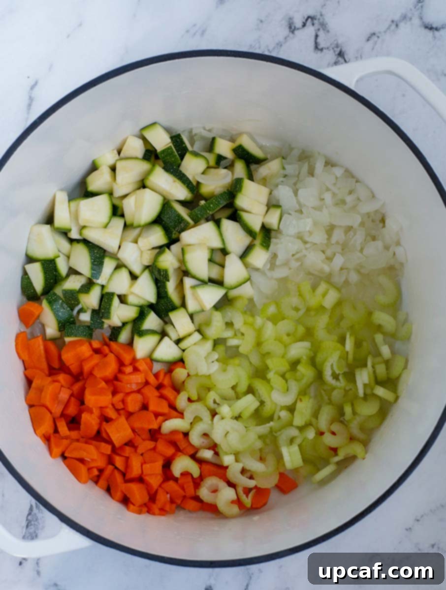 Rustic Vegetable Minestrone 4 Top down shot of various diced vegetables in a bowl, ready for cooking.