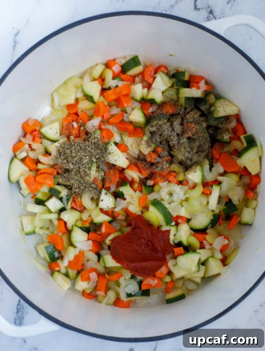 Rustic Vegetable Minestrone 5 Diced vegetables, seasoning, and tomato paste combined in a pot.