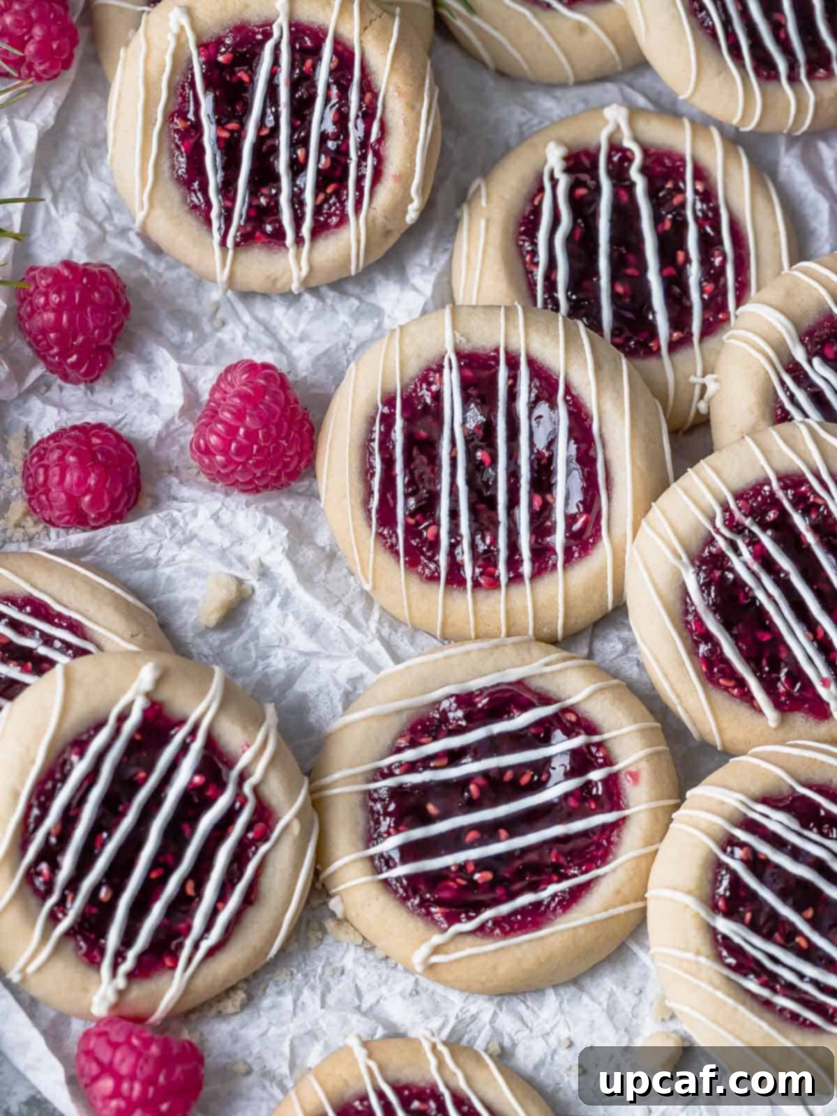 raspberry jam cookies drizzled with icing