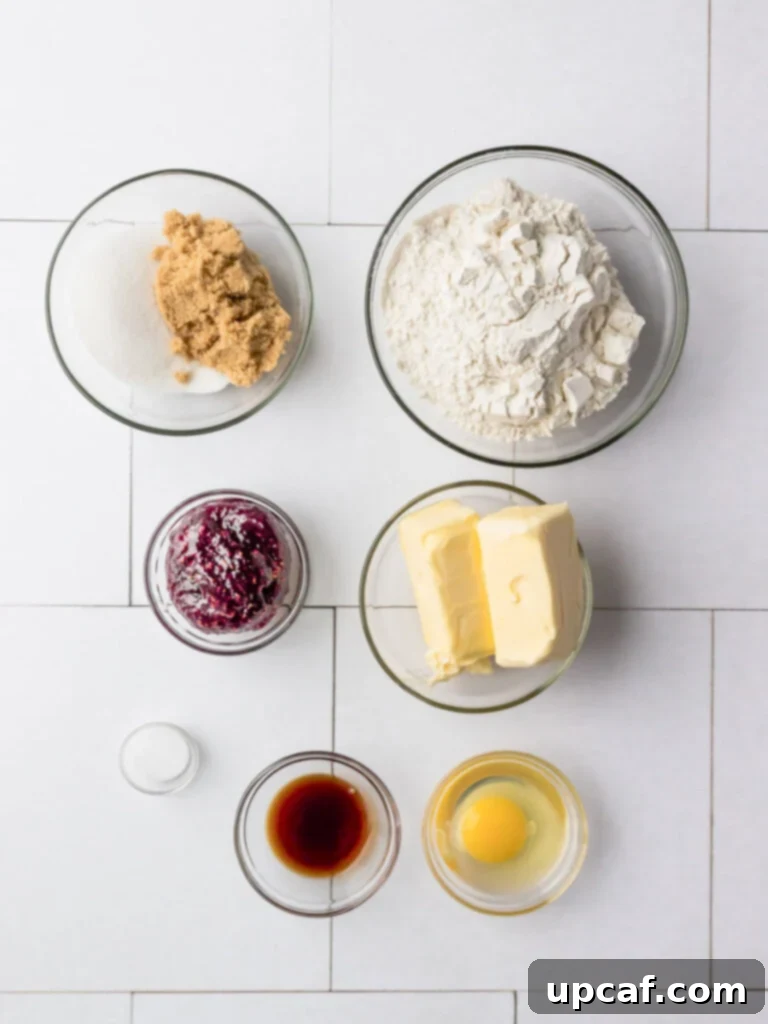 Top down view of ingredients for jam thumbprint cookies.