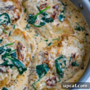 Top down shot of tuscan chicken in a pot.