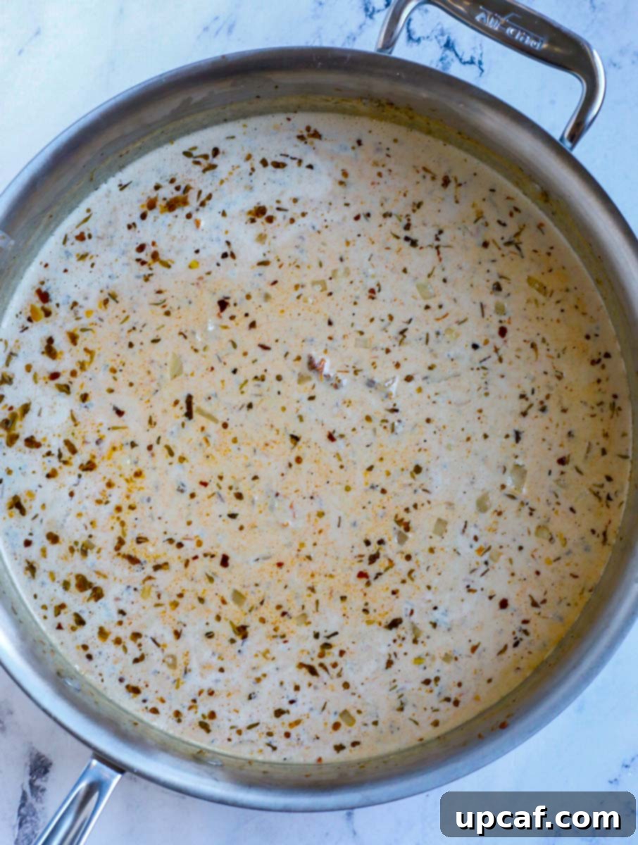 Heavy cream being poured into a pot.