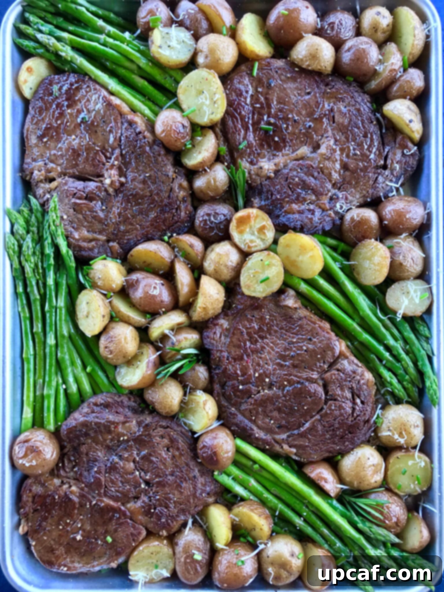 Perfectly cooked Steak and Potato with Asparagus on a sheet pan