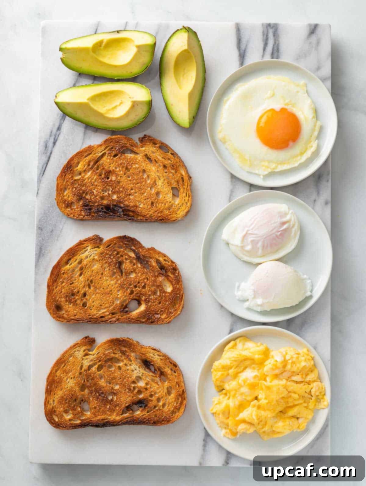 Ingredients of avocado toast laid out beautifully, ready for preparation.