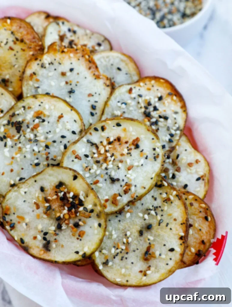 Everything Bagel Potato Crisps 2 Top down shot of crispy homemade Everything Bagel Potato Chips in a basket.