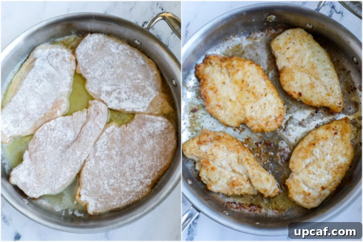 Top-down shot of chicken breasts pan-searing to a golden crisp in a hot skillet with olive oil and butter.