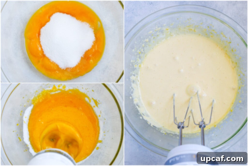 Effortless Crème Brûlée 5 Egg yolks and granulated sugar being whisked together in a glass bowl until light and fluffy.