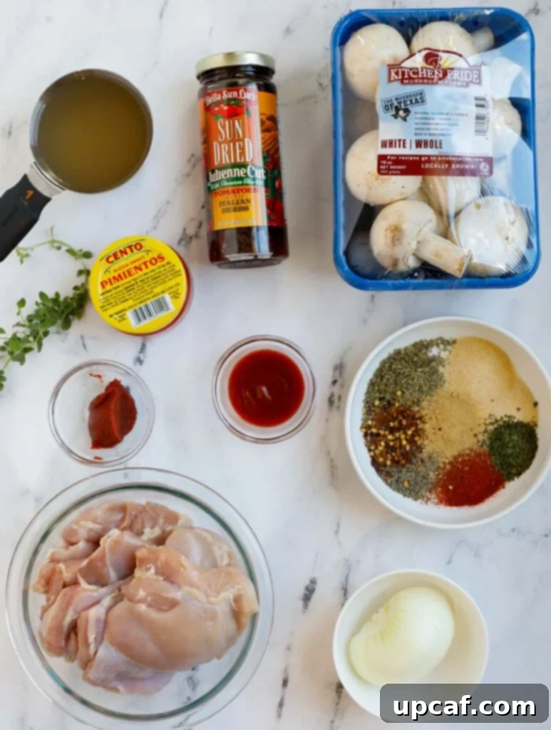 Creamy Tuscan Chicken Thighs 3 Top shot of fresh ingredients for tuscan chicken recipe, neatly arranged.