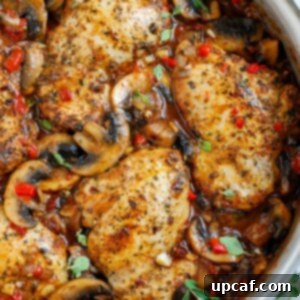 Creamy Tuscan Chicken Thighs 9 Top down shot of tuscan chicken in a pot.