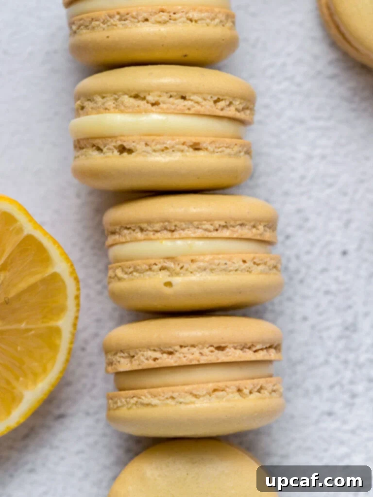 Stacked lemon macarons with vibrant yellow shells