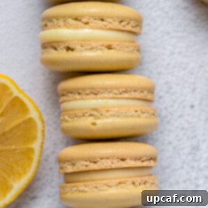 Stacked lemon macarons with vibrant yellow shells