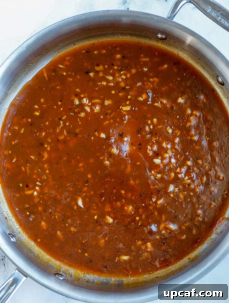 Skillet with thickened General Tso's sauce, ready for the chicken.