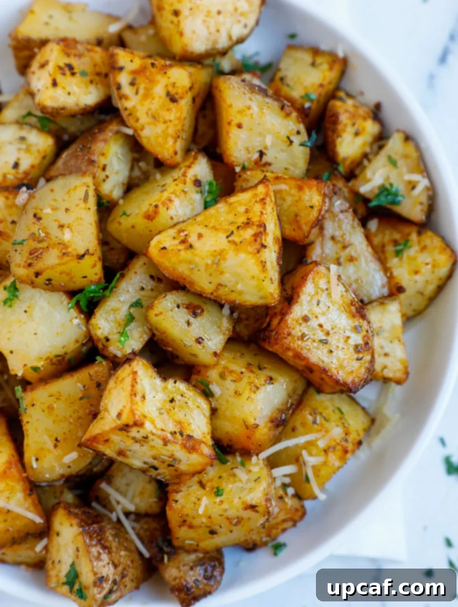 Diced air fryer roasted potatoes on a plate.