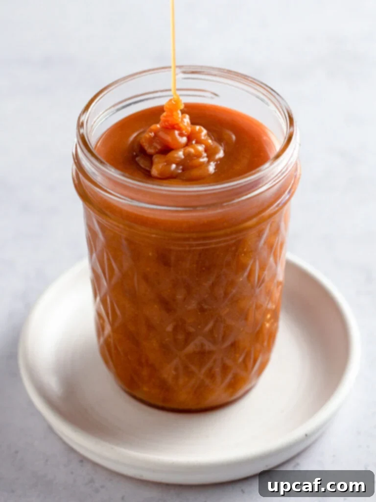 A final shot of the homemade caramel sauce, beautifully presented in a jar, ready to be enjoyed.
