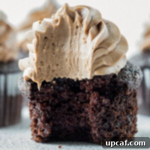 close up shot of chocolate cupcake with a bite taken out of it