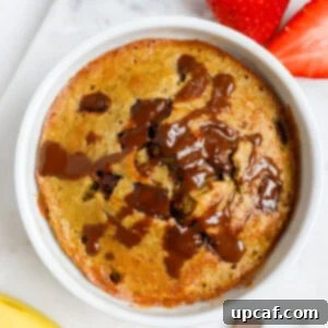 A perfectly baked individual serving of chocolate chip banana baked oats, ready to be enjoyed.