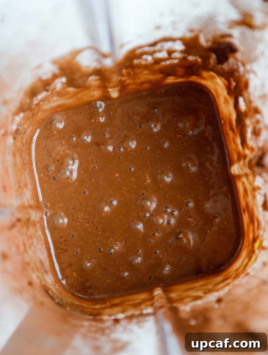 Chocolate Peanut Butter Banana Oatmeal Bake 5 Baked oats batter in a blender.