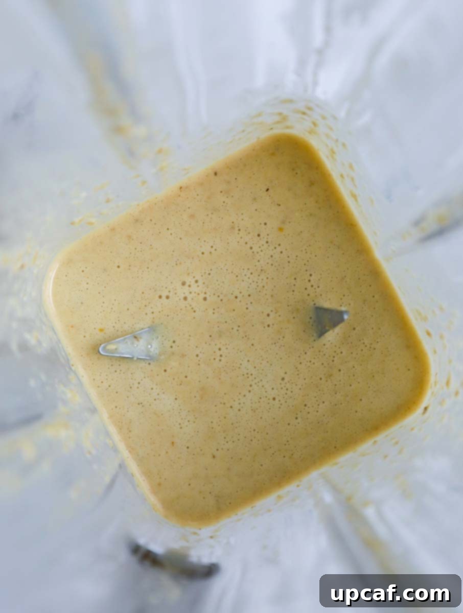 Batter for baked oatmeal inside of a blender, ready to be processed.