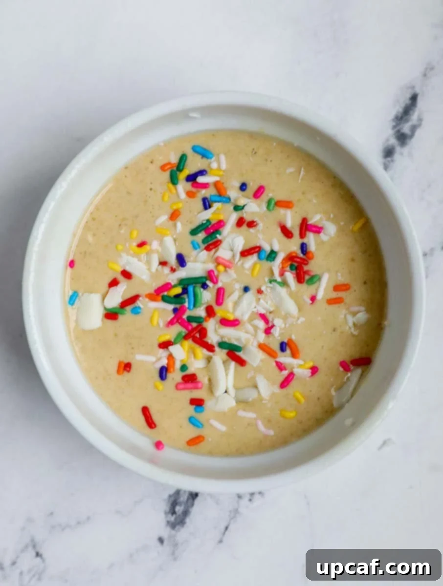Batter for baked oatmeal poured into a ramekin, ready for baking.