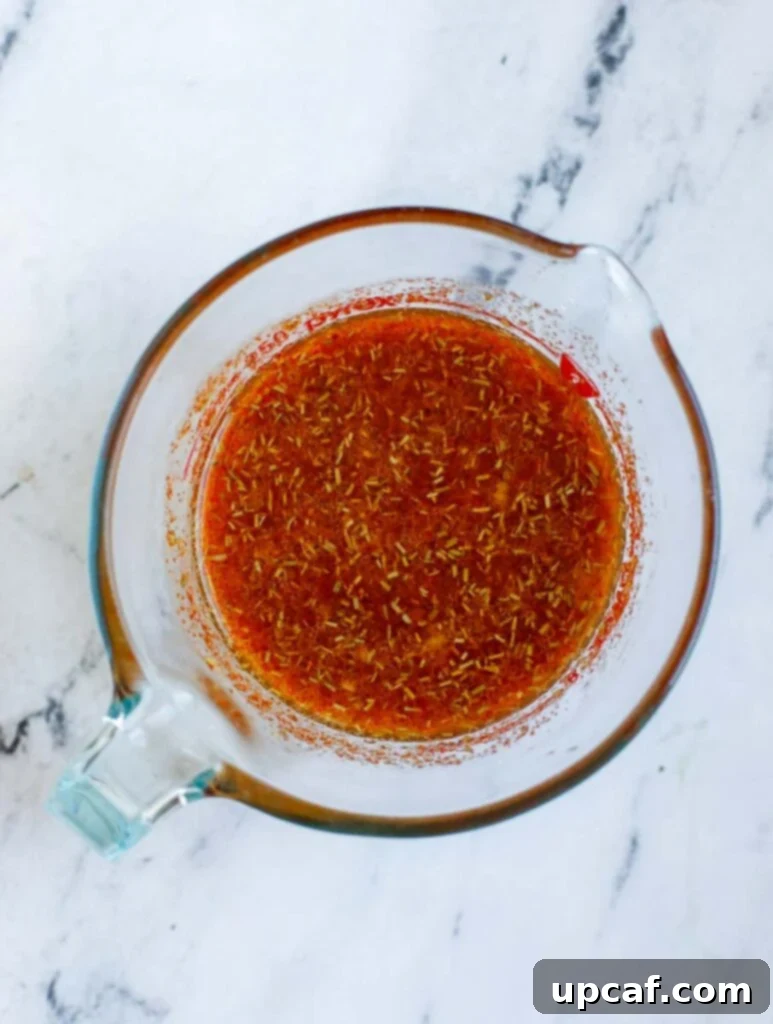 Sauce in a measuring cup.