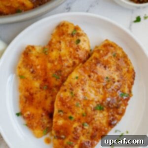 A plate of chicken with honey mustard sauce.