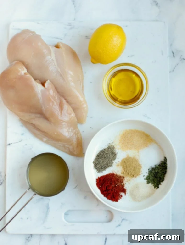 Overhead view of ingredients needed to make oven baked chicken breasts, neatly arranged.