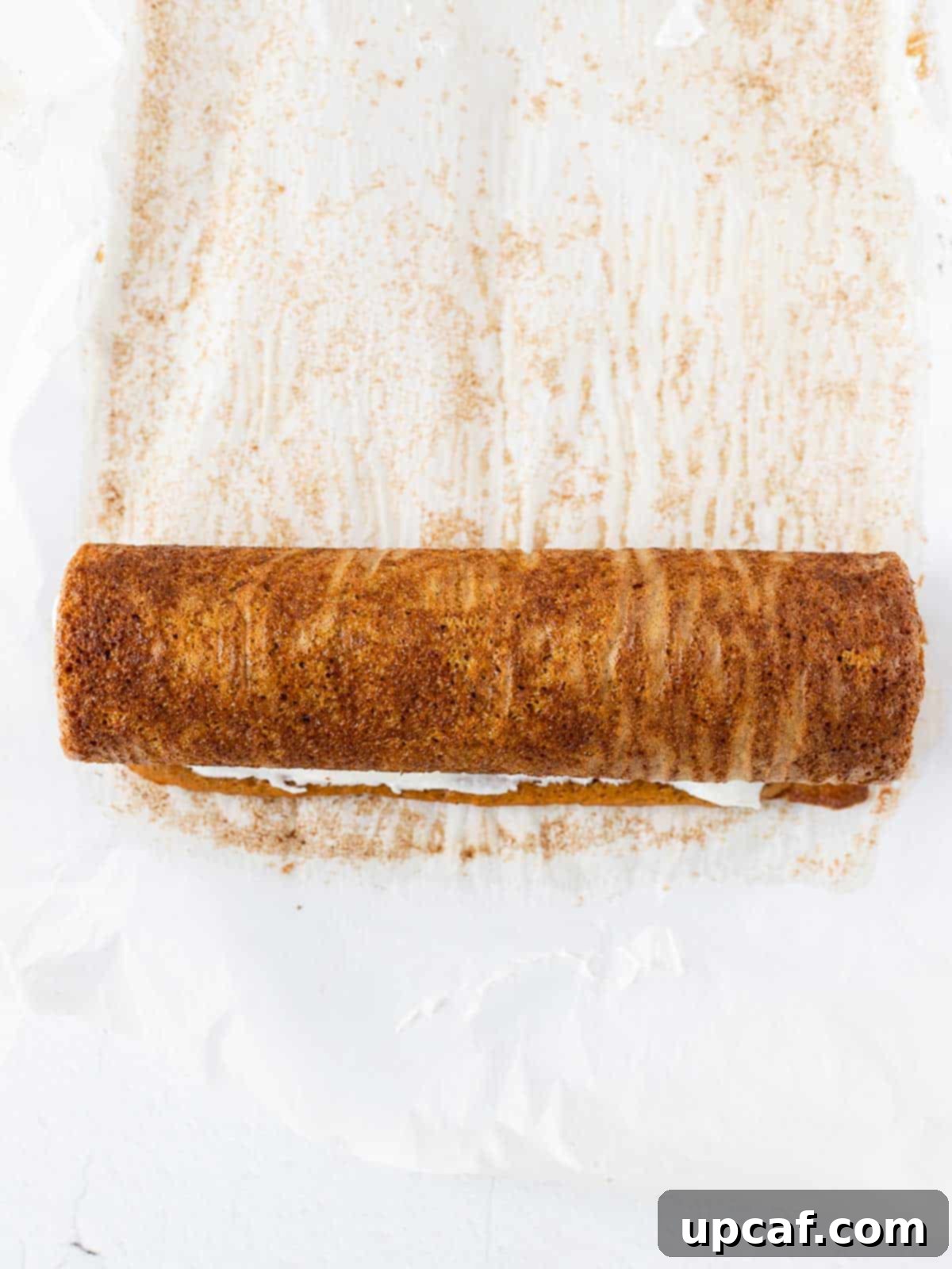a perfectly rolled pumpkin cake, cooling and ready for its creamy filling